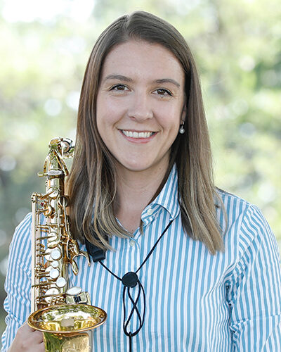 Headshot of Jess Voigt-Page with her soprano saxophone.