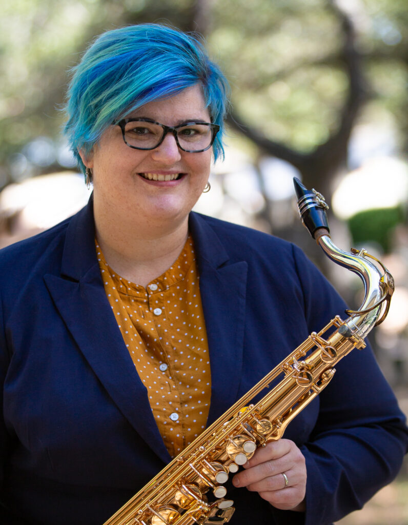 Headshot of Crystal Alexander-Duckett with her tenor saxophone.